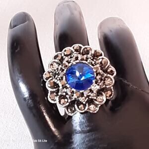 Large Cocktail Ring Central Blue Stone Surrounding Black Rhinestones